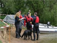 Picture of two judges informing an entrant of result and making comment