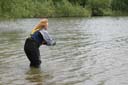 Picture of owner calling dog to shore