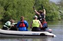 picture of steward falling overboard whilst brown newfoundland and owner with other stewards and judge wait in boat for exercise to start